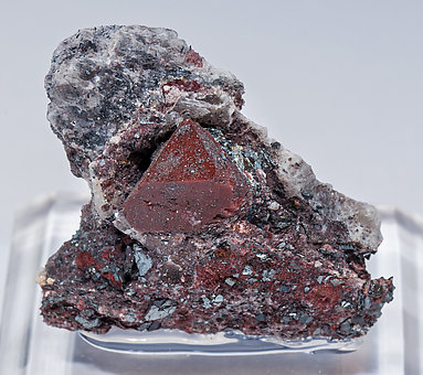 Zunyite with Hematite.