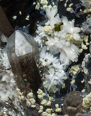 Bertrandite with Quartz (variety smoky) and Pyrite. 