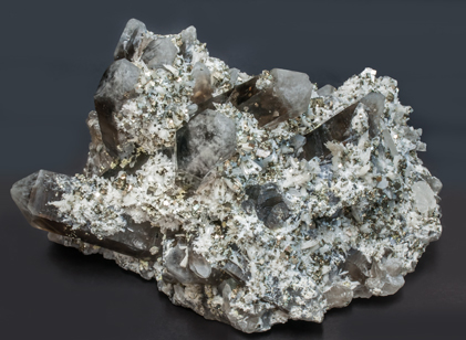 Bertrandite with Quartz (variety smoky) and Pyrite. Rear