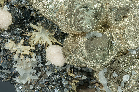 Pyrite after Pyrrhotite with Pyrite, Rhodochrosite, Sphalerite and Quartz. 