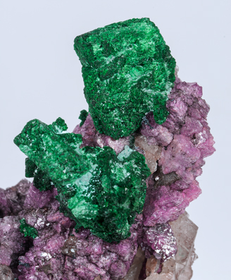Malachite after Azurite on Calcite (variety cobaltoan) and Calcite. 