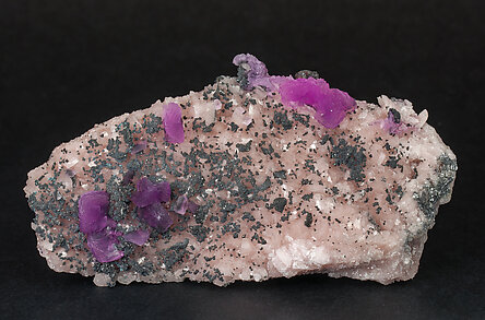 Calcite (variety cobaltoan) with Goethite and Quartz .