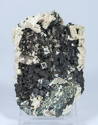 Magnetite (variety Ti-bearing) with Microcline and Quartz.