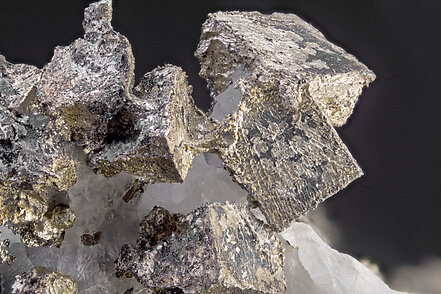 Silver with Silver (variety amalgamate - Hg-bearing), Lllingite and Calcite. micro photo: Dr. Csar Menor-Salvn