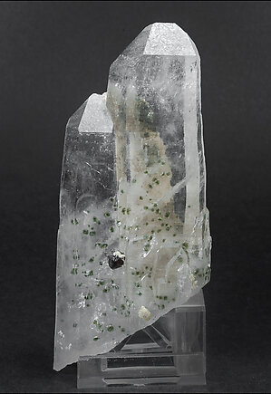 Quartz with Fluorapatite inclusions, Cassiterite and Siderite.