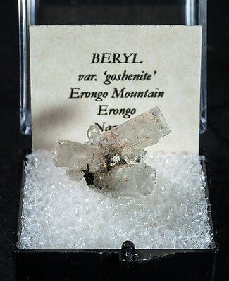 Beryl (variety goshenite) and Schorl.