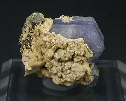 Fluorapatite with Cassiterite, Ferberite and Siderite.