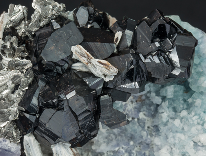 Cassiterite with Fluorite, Arsenopyrite and Mica. 