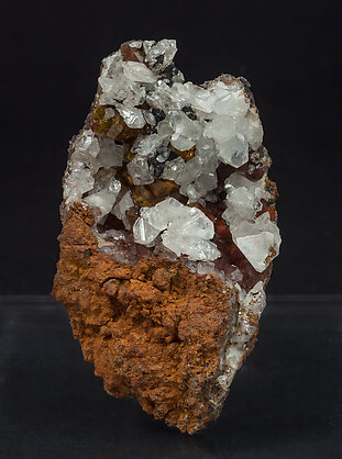 Cerussite on Quartz with iron oxides inclusions.