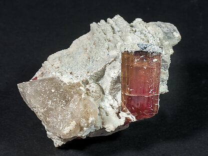 Elbaite-Schorl (variety rubellite) with Microcline and Quartz.