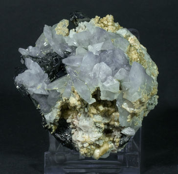 Fluorapatite with Ferberite, Siderite and Calcite-Dolomite.