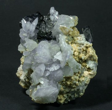 Fluorapatite with Ferberite, Siderite and Calcite-Dolomite. Side