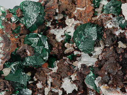 Malachite (primary) with Quartz and Chalcopyrite. 