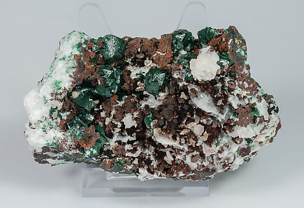 Malachite (primary) with Quartz and Chalcopyrite. 