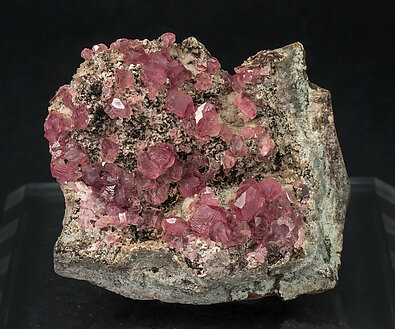 Rhodochrosite with manganese oxides. 