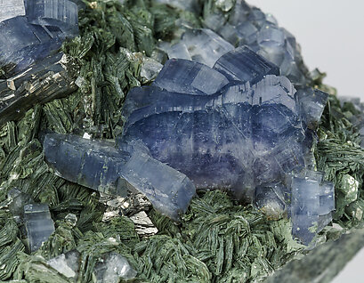 Fluorapatite with Arsenopyrite, Muscovite and Chlorite. 