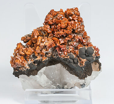 Vanadinite with manganese oxides and Quartz. 