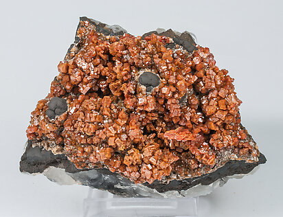 Vanadinite with manganese oxides and Quartz. 