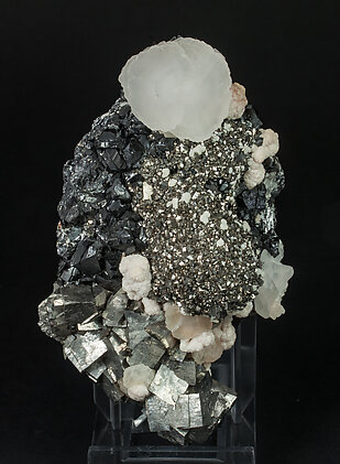 Arsenopyrite with Calcite, Pyrite, Sphalerite and Rhodochrosite. 