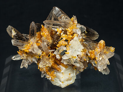 Zircon with Quartz (variety smoky), Orthoclase and Aegirine.