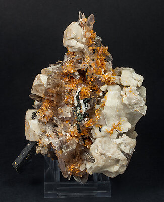 Zircon with Quartz (variety smoky), Orthoclase and Aegirine.