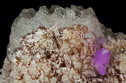 Talmessite coating Calcite and with Calcite (variety Co-bearing calcite). 