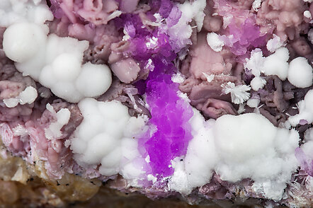 Talmessite coating Calcite and with Calcite (variety Co-bearing calcite). 