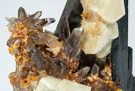 Aegirine with Zircon, Orthoclase and Quartz (variety smoky). 