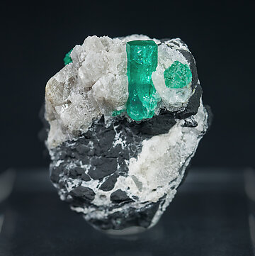 Beryl (variety emerald) on Calcite.