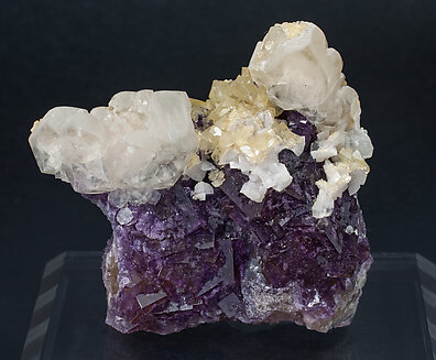 Fluorite with Calcite, Baryte and Dolomite.