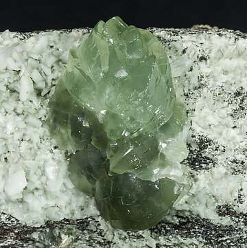 Prehnite with Orthoclase (variety adular) and Actinolite (variety byssolite). 