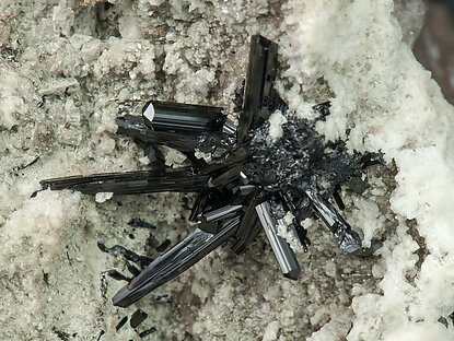 Tourmaline (Group) with Hematite (variety iron rose), Quartz and Feldspar. 