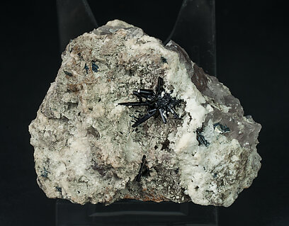 Tourmaline (Group) with Hematite (variety iron rose), Quartz and Feldspar.