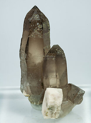 Quartz (variety smoky quartz) with Clinozoisite-Epidote and Microcline.