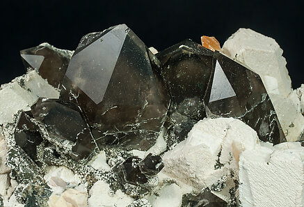 Quartz (variety smoky quartz) with Orthoclase and Mica. 