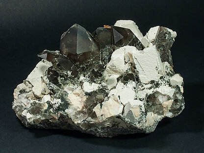 Quartz (variety smoky quartz) with Orthoclase and Mica. 