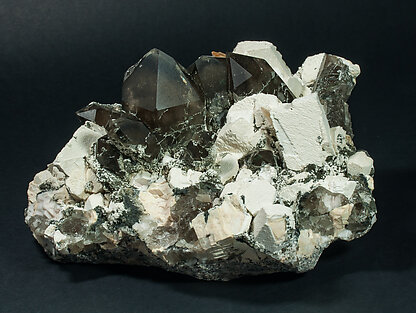 Quartz (variety smoky quartz) with Orthoclase and Mica.