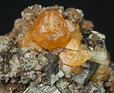 Scheelite with Arsenopyrite, Cassiterite, Muscovite and Quartz. 