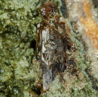 Vesuvianite with Diopside, Phlogopite and Muscovite. 