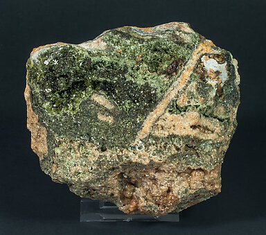 Vesuvianite with Diopside, Phlogopite and Muscovite. 