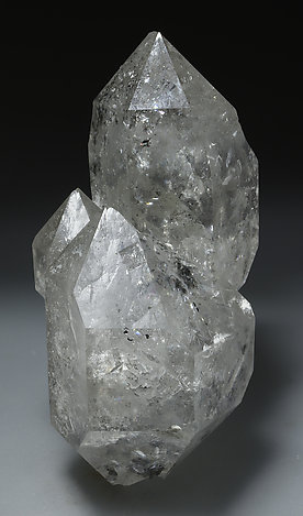 Doubly terminated Quartz with inclusions of hydrocarbons.