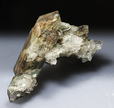 Quartz (variety smoky) with inclusions and Chlorite.