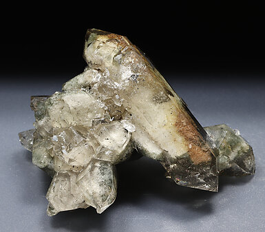 Quartz (variety smoky) with inclusions and Chlorite. 