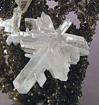 Cerussite on Quartz with Goethite inclusions. 