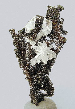 Cerussite on Quartz with Goethite inclusions.