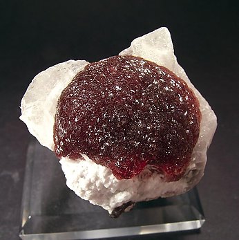 Elbaite (variety rubellite) with Calcite and Quartz.