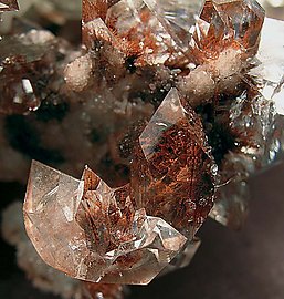 Fluorapophyllite-(K) with Julgoldite-Fe inclusions. 