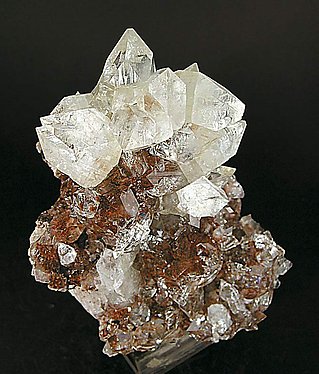 Fluorapophyllite-(K) with Julgoldite-Fe inclusions.