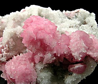 Rhodochrosite on Quartz. 