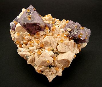 Octahedral Fluorite on Orthoclase and Spessartine.